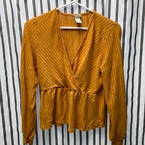 Cross top, yellow colored, kinda crop top , good condition